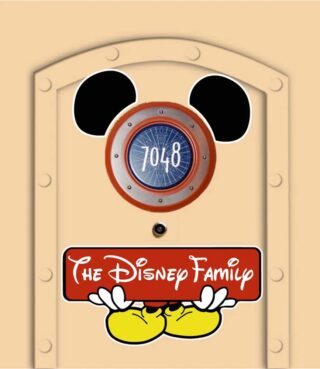 Mickey Mouse character integrated into stateroom number sign. Mickey is holding a banner that reads "The Disney Family"