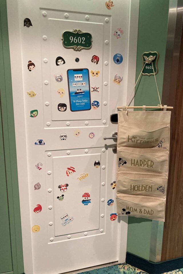 Stateroom door simply decorated with character magnets and a fish extender