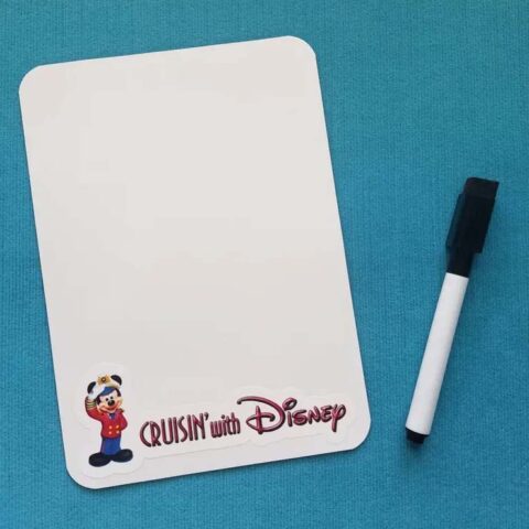 Small dry erase memo board reading "Cruising with Disney". Includes a magnetic dry erase marker with an eraser top.