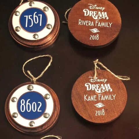 Christmas ornaments shaped like the stateroom door number sign. The front reads the stateroom number and the back reads "Disney Dream, Kane Family, 2018".