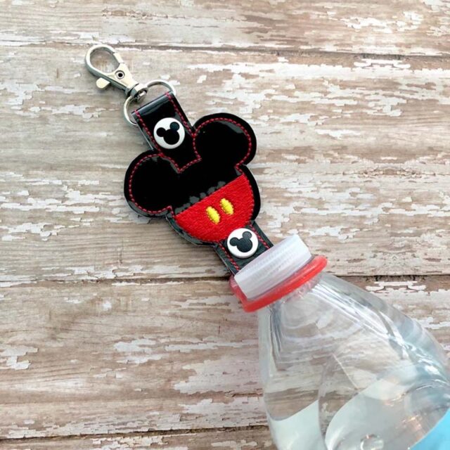 Black water bottle clip with the Disney Cruise Line logo, attached to a water bottle on one end and with a carabiner clip on the other end